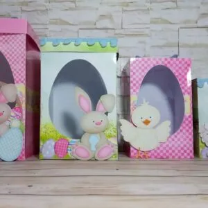 Arquivo de Corte Caixas Ovo em Pé Páscoa 16 Quatro caixas de papel decoradas com tema de Páscoa e aberturas em formato de ovo