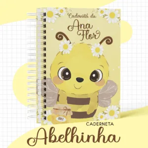 Caderno espiral amarelo com ilustração de abelha fofa e margaridas brancas.