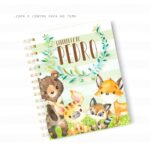 Caderno espiral com ilustrações em aquarela de animais da floresta e folhagens.