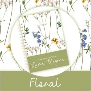 Caderno espiralado com estampa floral delicada sobre fundo branco e verde.
