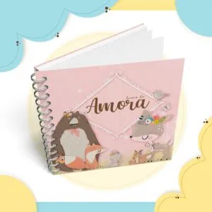 Caderno espiralado rosa com ilustrações de animais fofos na capa.