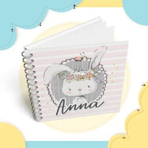 Livro do Bebê Coelhinha 1 5 Caderno espiral com capa ilustrada de coelho fofo e fundo rosa listrado.