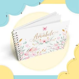Caderno espiral horizontal com capa decorada com flores e borboletas em aquarela.